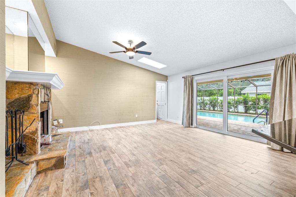 3404 Brian Road South Palm Harbor, FL 34685 - Photo 5 of 71 a view of empty room with wooden floor and fan