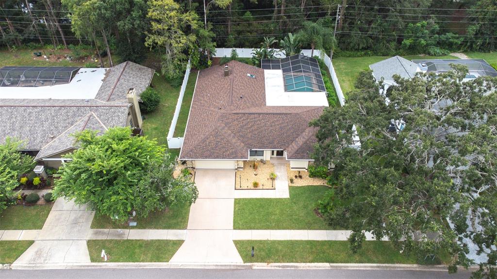 3404 Brian Road South Palm Harbor, FL 34685 - Photo 62 of 71 an aerial view of a house with a yard and large trees