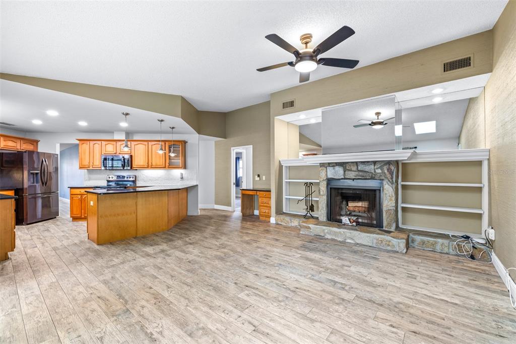 3404 Brian Road South Palm Harbor, FL 34685 - Photo 8 of 71 a view of a kitchen with microwave and fireplace