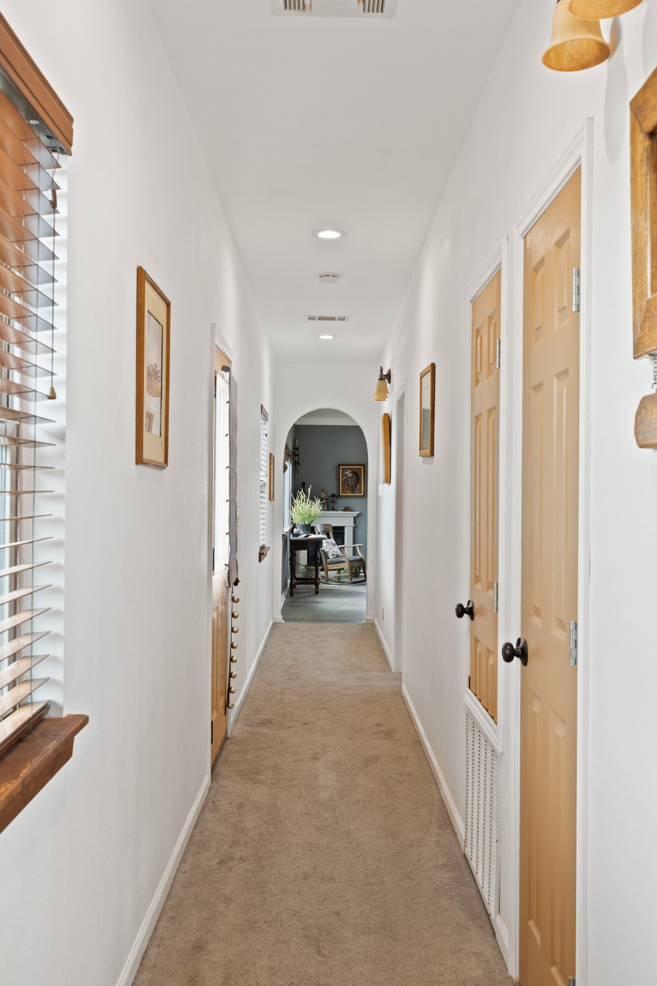 2966 Rm 165 Dripping Springs Dripping Springs, TX 78620 - Photo 15 of 23 Neutral-toned hallway featuring carpeted flooring, recessed ceiling lighting, and multiple paneled doors