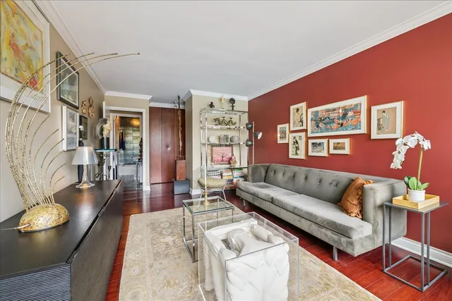 a view of a living room with furniture and a large window