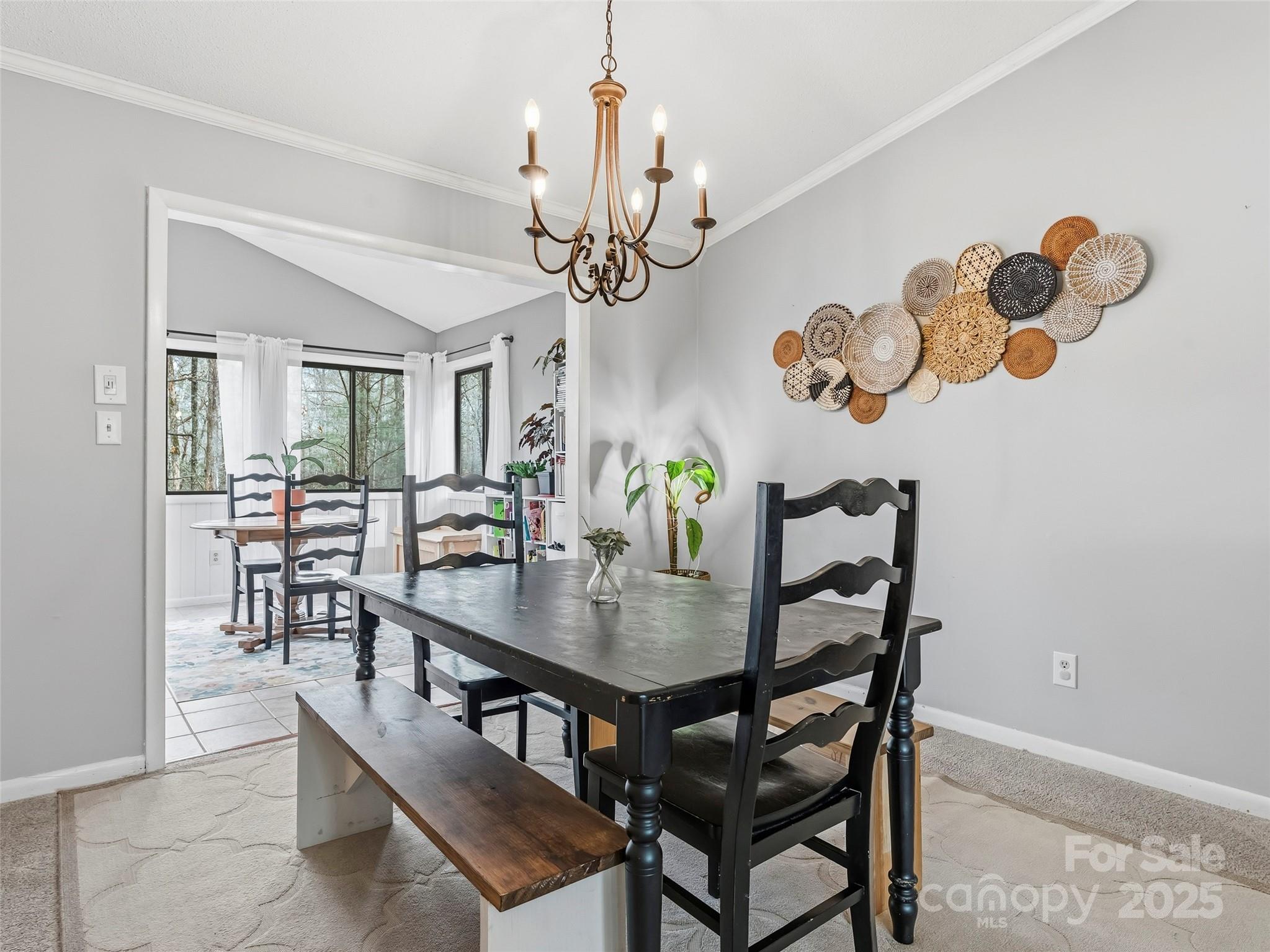 531 Three Mile Knob Road Pisgah Forest, NC 28768 - Photo 11 of 37 a view of a dining room with furniture and chandelier