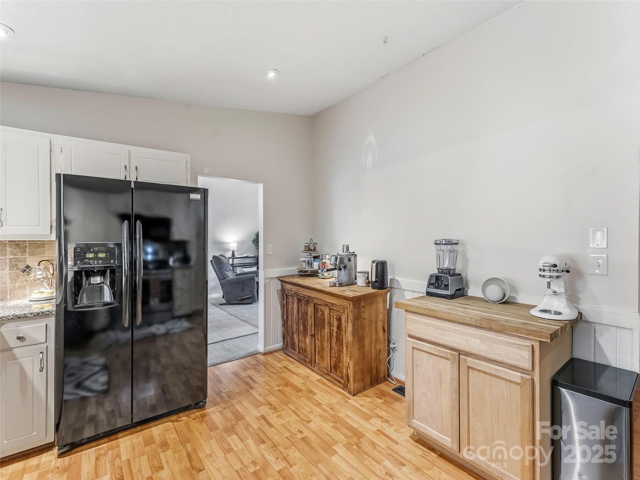 531 Three Mile Knob Road Pisgah Forest, NC 28768 - Photo 14 of 37 a kitchen with a sink stove and refrigerator