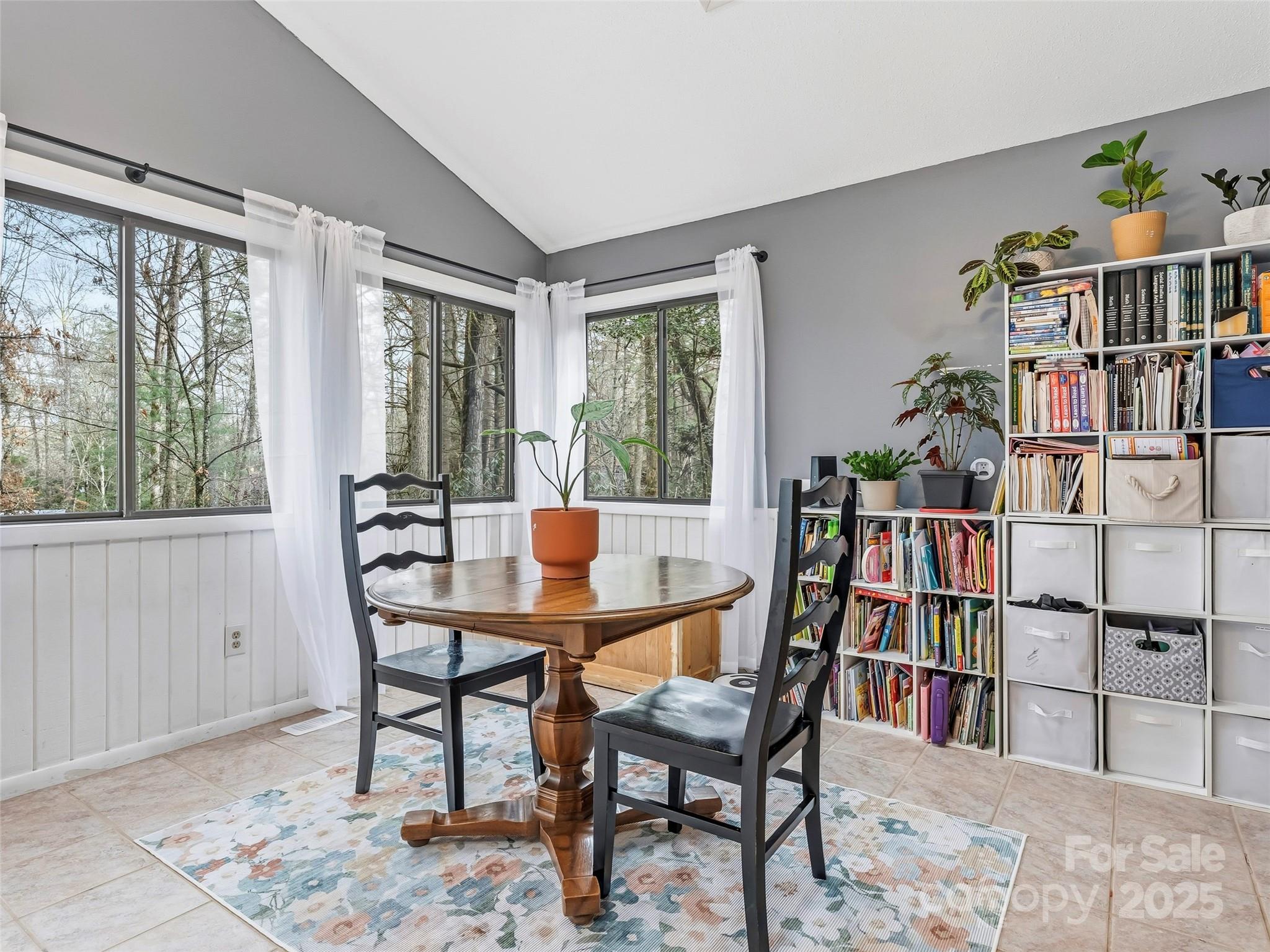 531 Three Mile Knob Road Pisgah Forest, NC 28768 - Photo 15 of 37 a view of a workspace with furniture and a book shelf