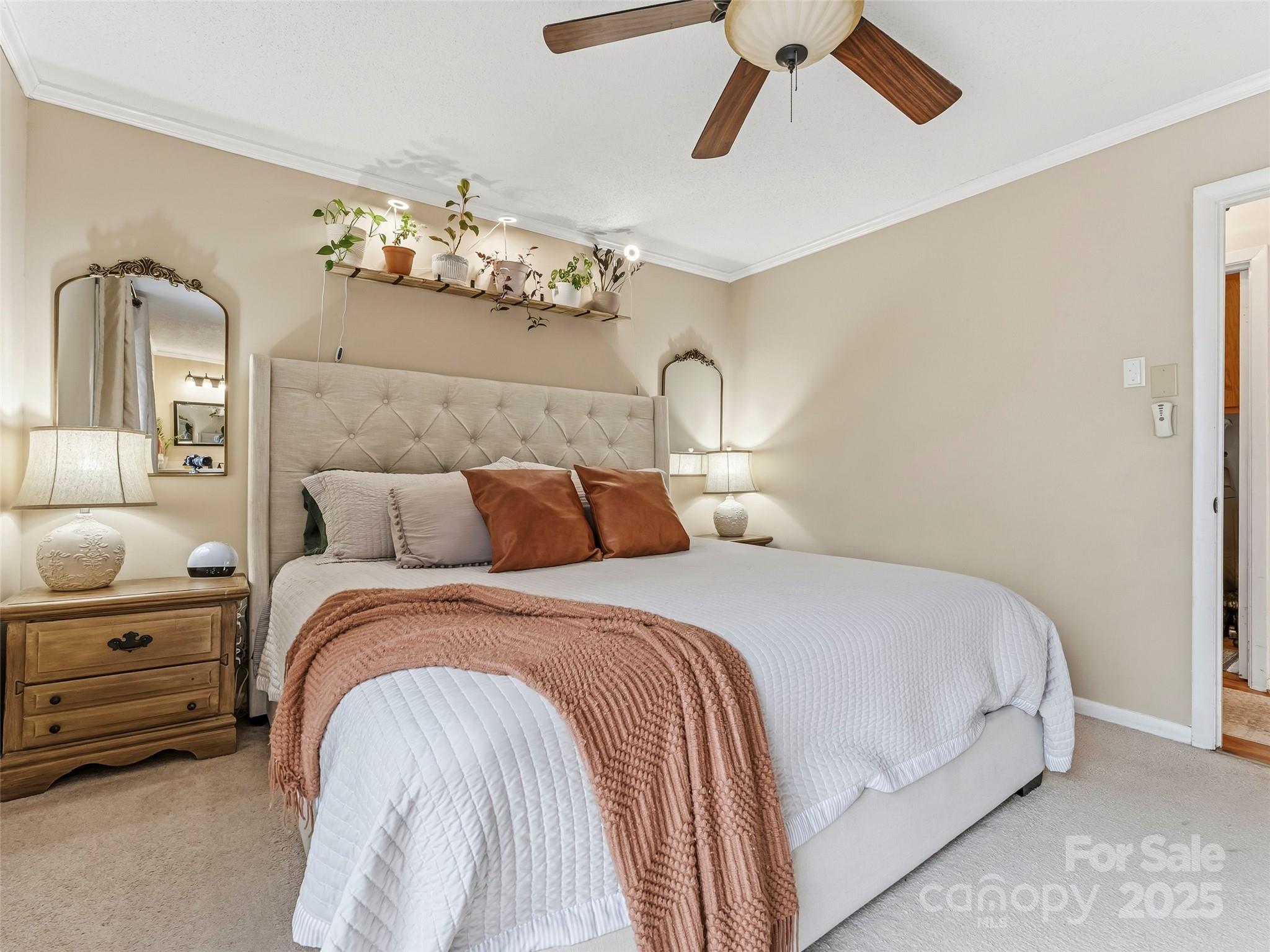 531 Three Mile Knob Road Pisgah Forest, NC 28768 - Photo 20 of 37 a bedroom with a bed and ceiling fan
