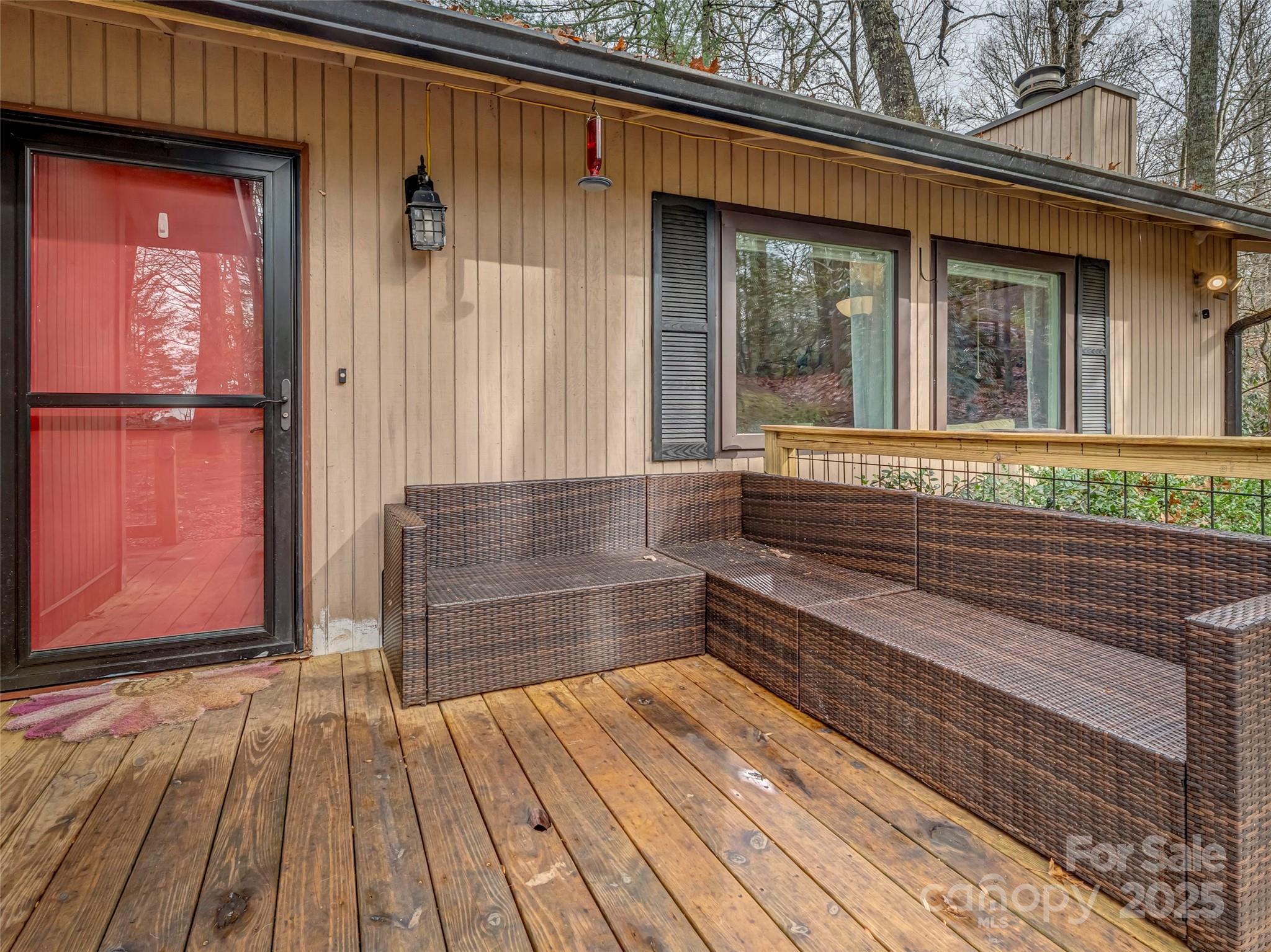 531 Three Mile Knob Road Pisgah Forest, NC 28768 - Photo 2 of 37 a view of outdoor space with deck and flat screen tv