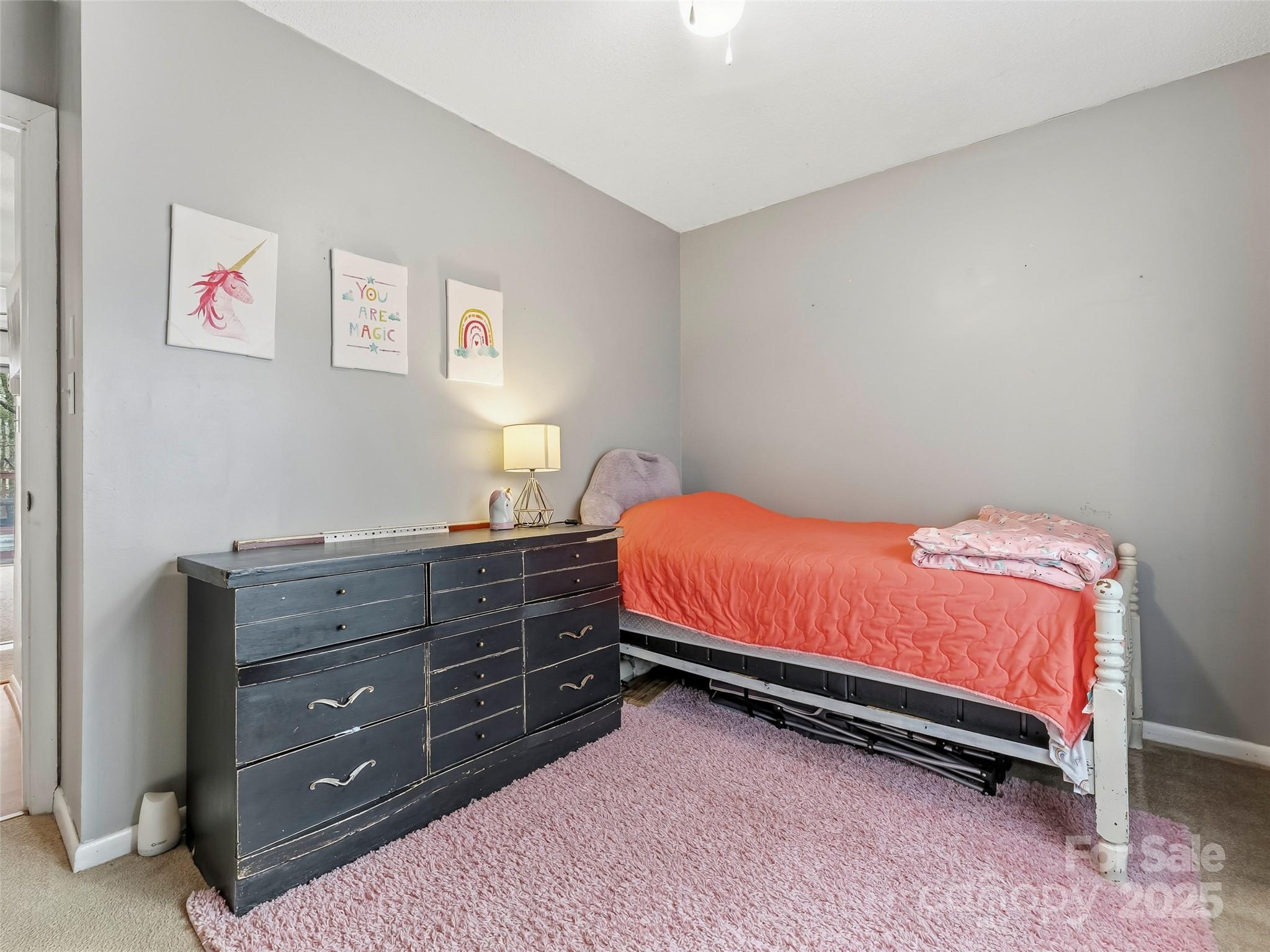 531 Three Mile Knob Road Pisgah Forest, NC 28768 - Photo 25 of 37 a bedroom with a bed and a dresser