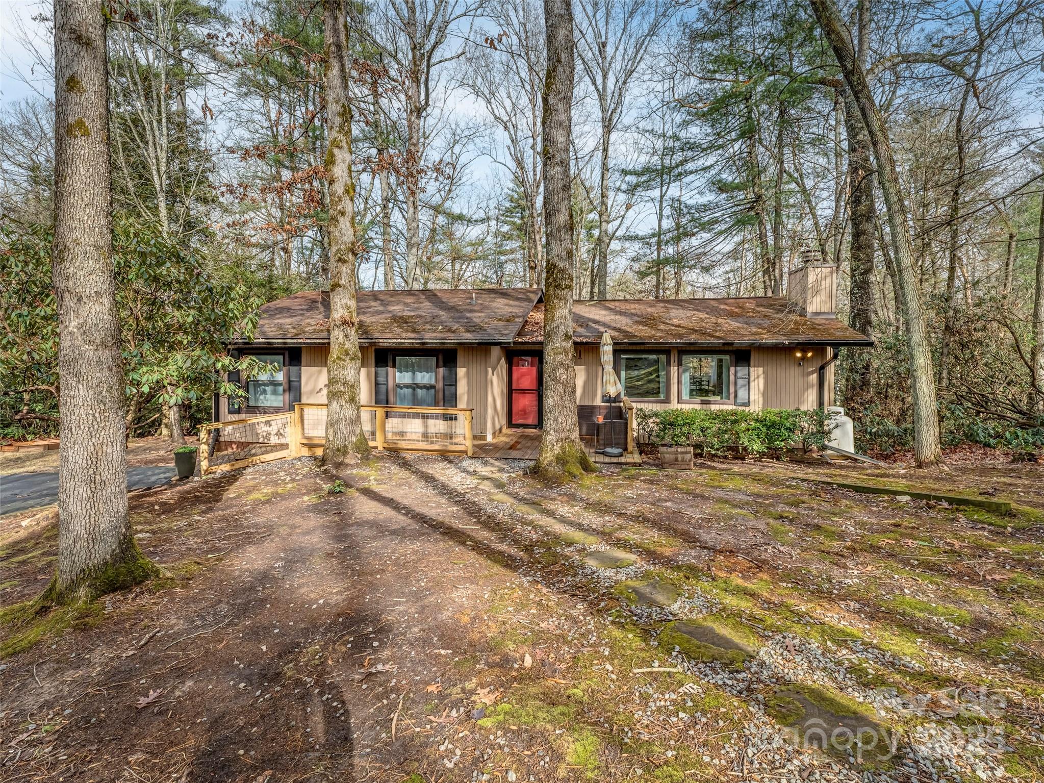 531 Three Mile Knob Road Pisgah Forest, NC 28768 - Photo 32 of 37 front view of a brick house with a large tree