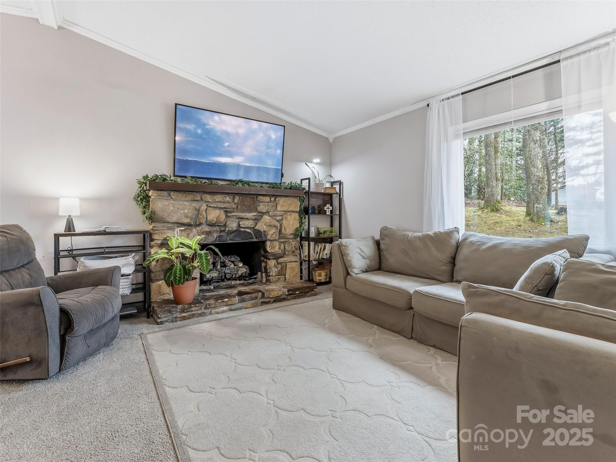 531 Three Mile Knob Road Pisgah Forest, NC 28768 - Photo 4 of 37 a living room with furniture a window and a fireplace