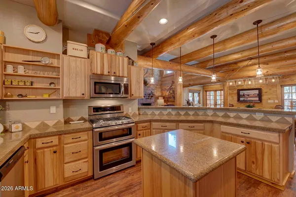 a kitchen with stainless steel appliances granite countertop a stove and a sink