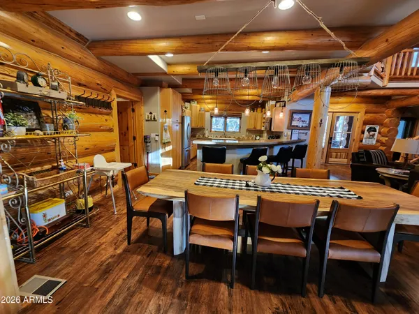 a dinning table and chairs in a room