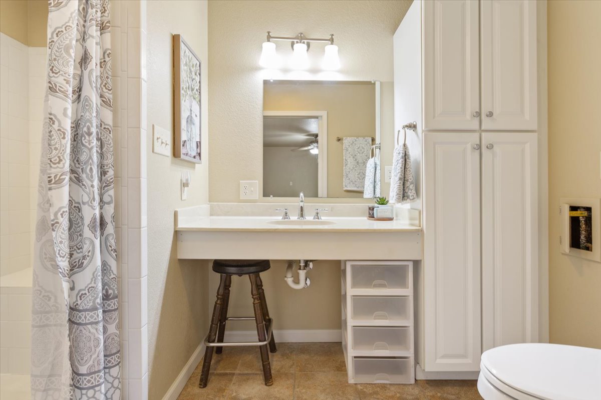 4015 Ramada Trail Georgetown, TX 78628 - Photo 24 of 35 Full bathroom featuring a tile shower, vanity, and a closet