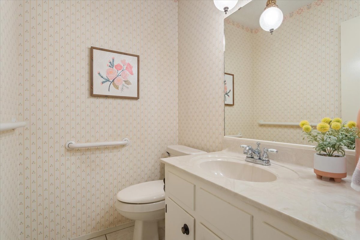4015 Ramada Trail Georgetown, TX 78628 - Photo 28 of 35 Half bath with vanity and tile patterned flooring