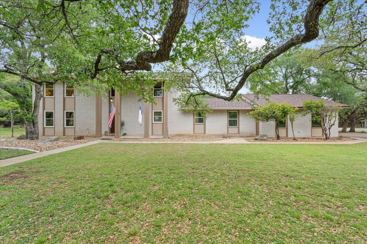 4015 Ramada Trail Georgetown, TX 78628 - Photo 8 of 35 View of front of house with a front lawn and brick siding