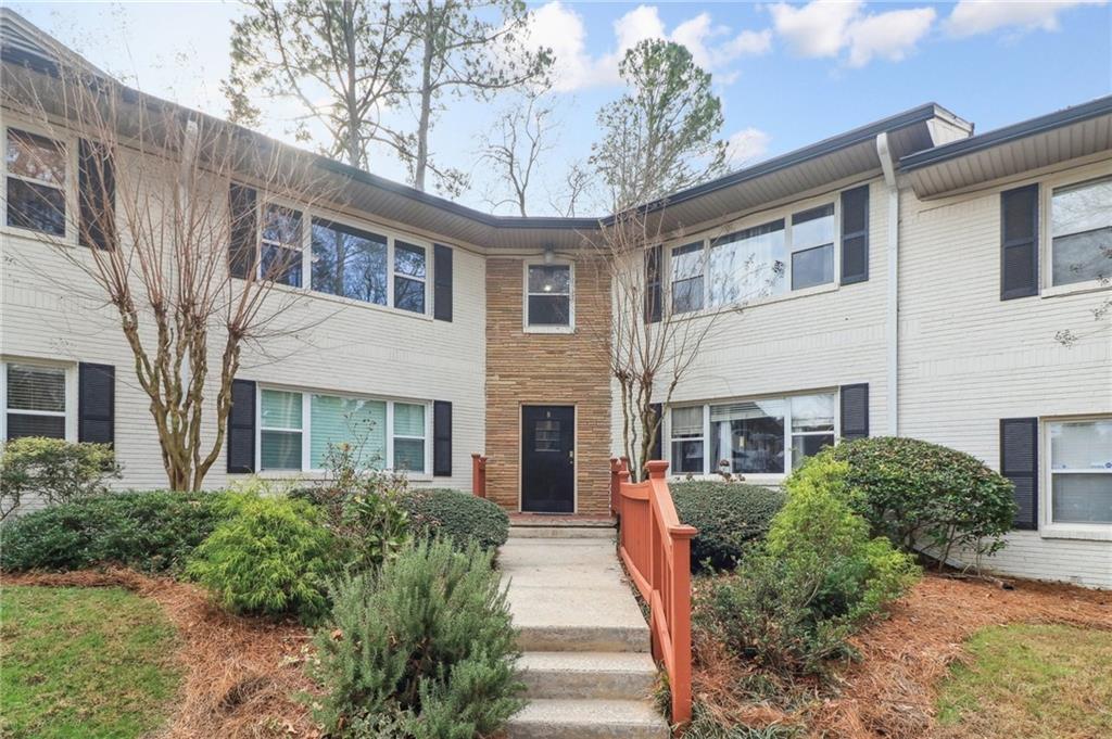 2477 North Decatur Road, Unit B4 Decatur, GA 30033 - Photo 1 of 25 a front view of a house with a yard and potted plants