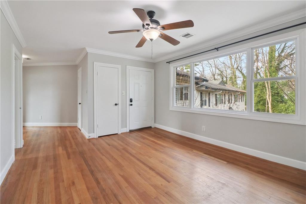 2477 North Decatur Road, Unit B4 Decatur, GA 30033 - Photo 11 of 25 a view of an empty room with a window and wooden floor