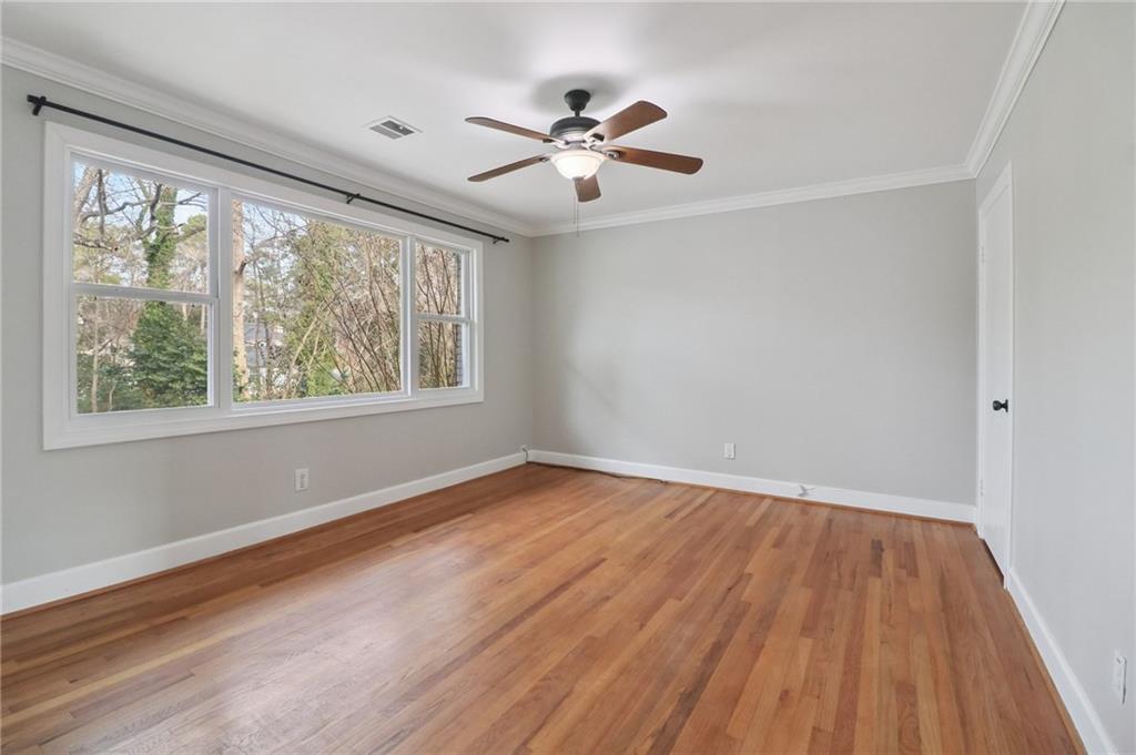 2477 North Decatur Road, Unit B4 Decatur, GA 30033 - Photo 12 of 25 a view of an empty room with wooden floor and a window