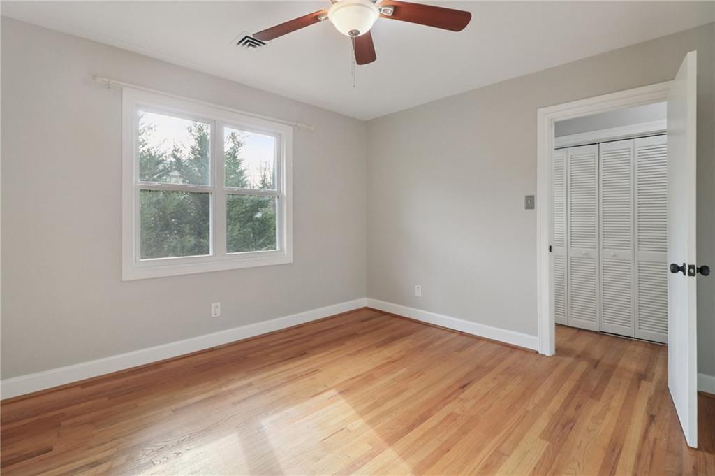2477 North Decatur Road, Unit B4 Decatur, GA 30033 - Photo 13 of 25 a view of an empty room with wooden floor and a window