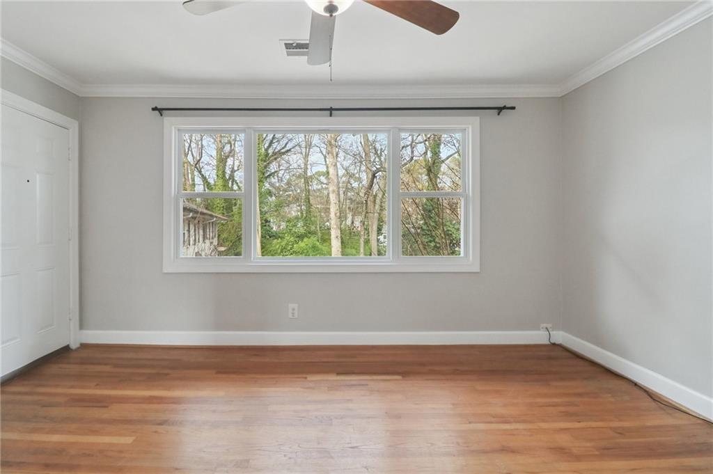 2477 North Decatur Road, Unit B4 Decatur, GA 30033 - Photo 9 of 25 a view of empty room with wooden floor and fan