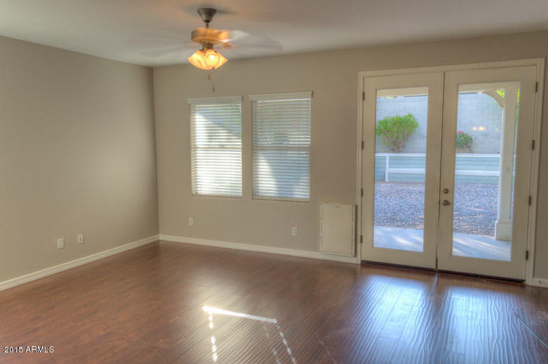20774 West Ridge Road Buckeye, AZ 85396 - Photo 8 of 23 wooden floor in an empty room with a window