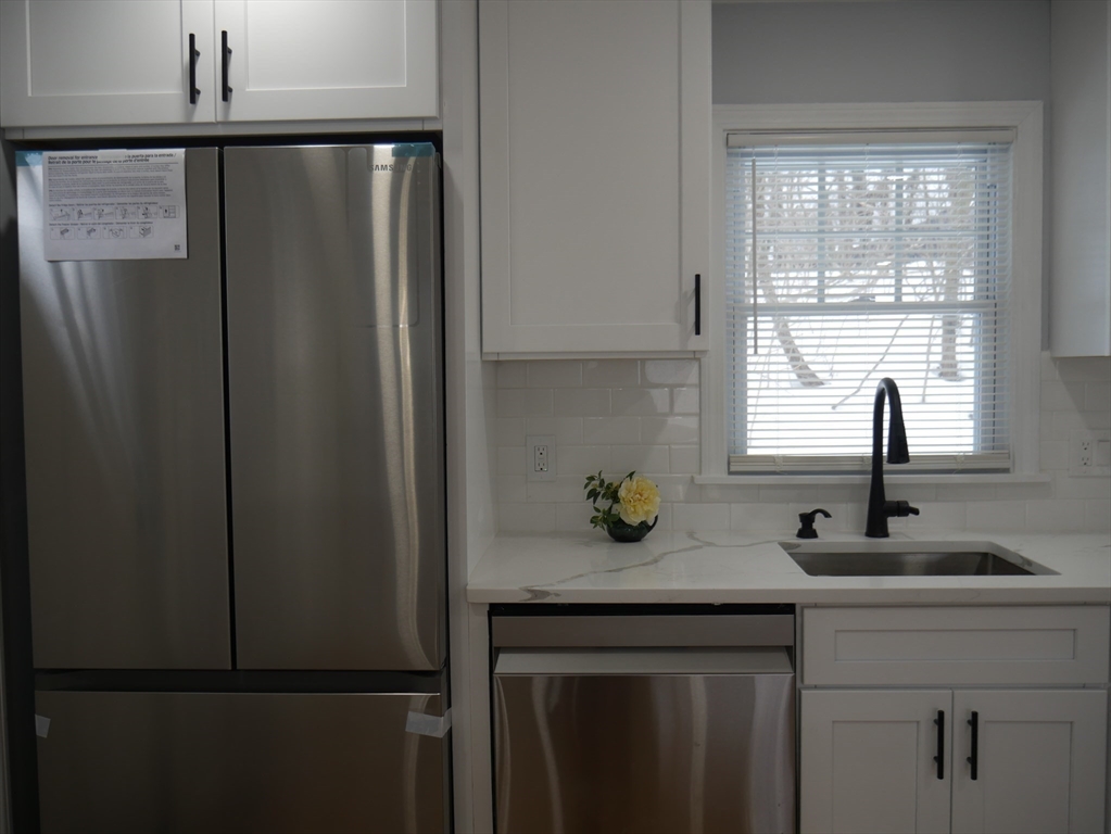 54 Harris Road Lynn, MA 01904 - Photo 11 of 41 a kitchen with a sink and a window