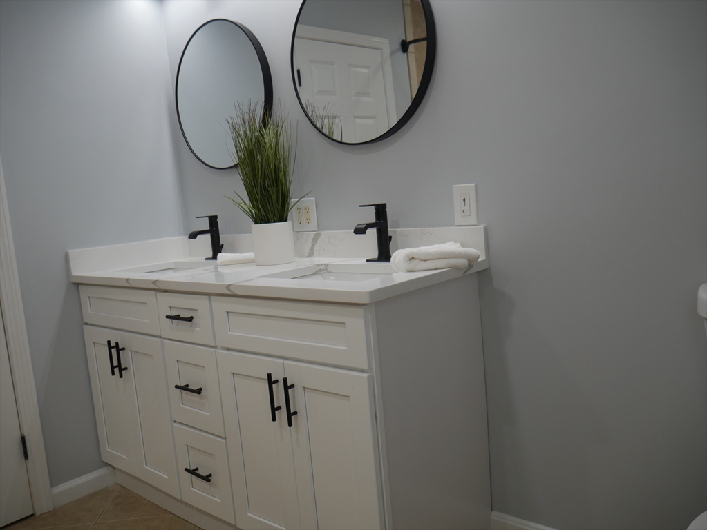 54 Harris Road Lynn, MA 01904 - Photo 21 of 41 a bathroom with a sink and a mirror