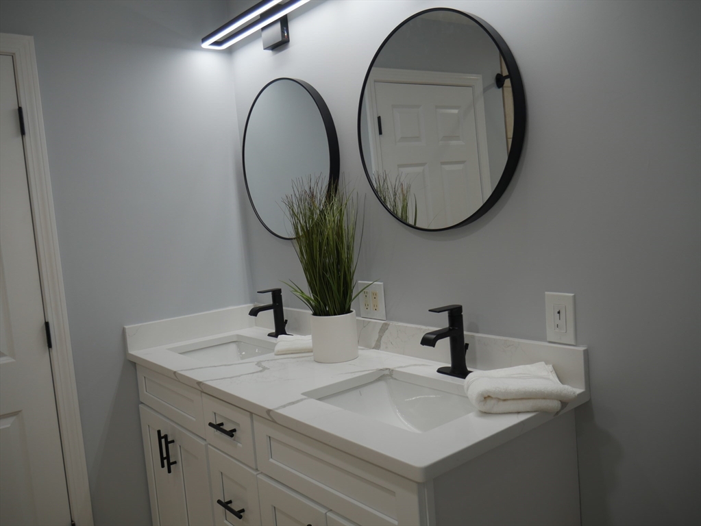 54 Harris Road Lynn, MA 01904 - Photo 28 of 41 a bathroom with a sink and a mirror