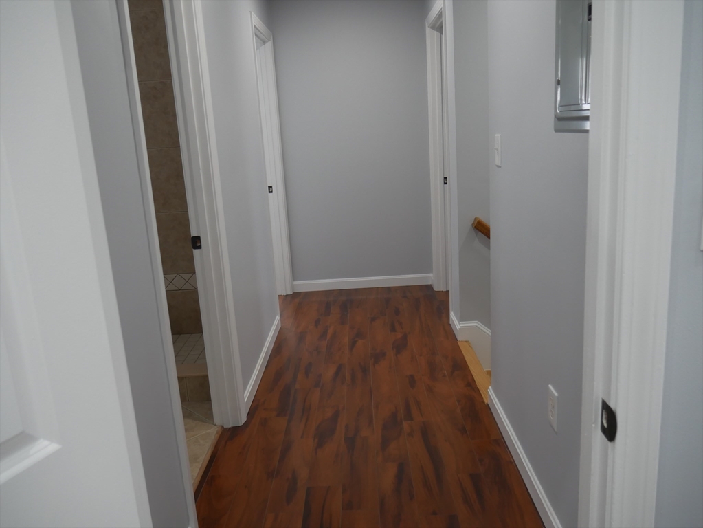 54 Harris Road Lynn, MA 01904 - Photo 31 of 41 a view of a hallway with wooden floor