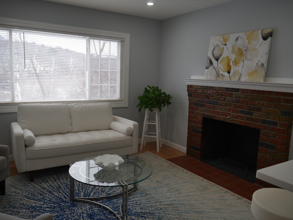 54 Harris Road Lynn, MA 01904 - Photo 6 of 41 a living room with furniture and a fireplace