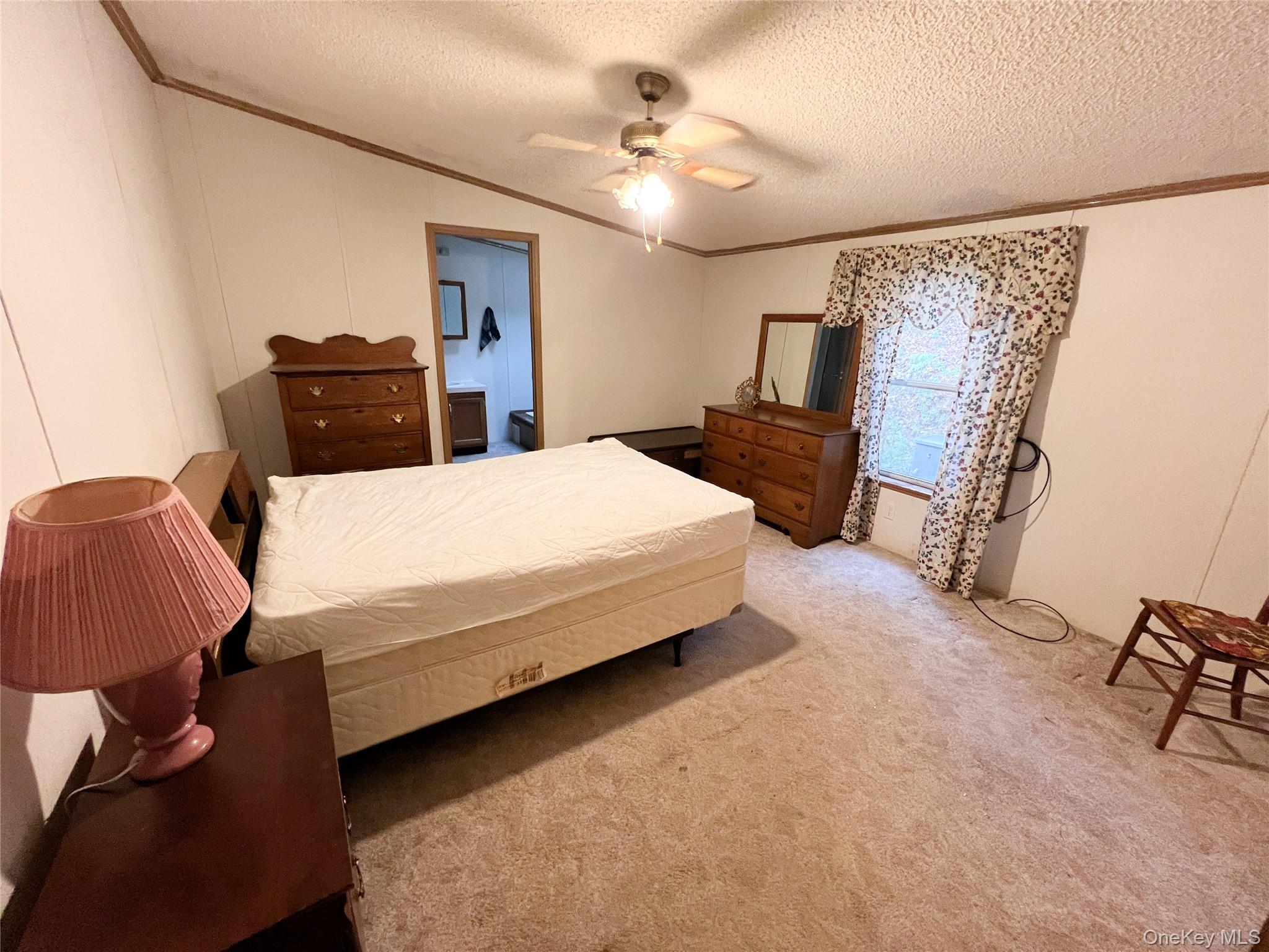 509 Burnwood Road East Branch, NY 13756 - Photo 13 of 14 a bedroom with a bed and dresser
