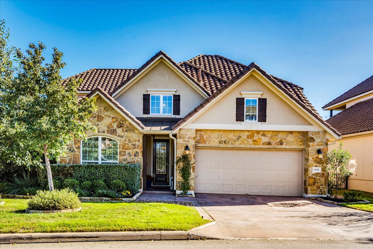 a front view of a house with yard