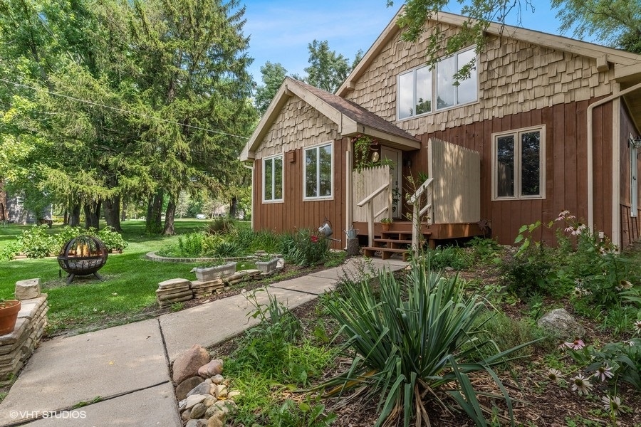 a front view of a house with garden