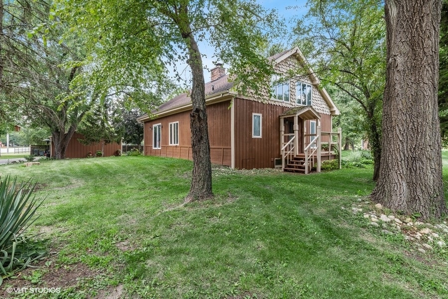 28W740 Army Trail Road West Chicago, IL 60185 - Photo 2 of 24 a front view of house with yard and green space