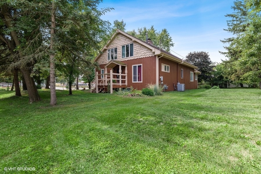 28W740 Army Trail Road West Chicago, IL 60185 - Photo 3 of 24 a view of a house with a big yard