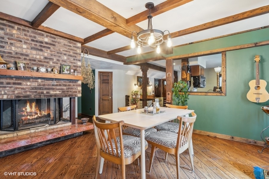 28W740 Army Trail Road West Chicago, IL 60185 - Photo 8 of 24 a view of a dining room with furniture and chandelier