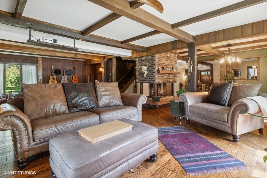 28W740 Army Trail Road West Chicago, IL 60185 - Photo 9 of 24 a living room with furniture and a large window