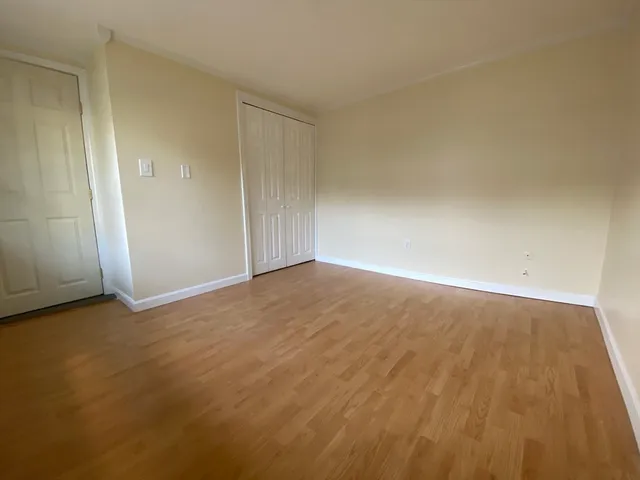 a view of a house with wooden floor and a potted plant