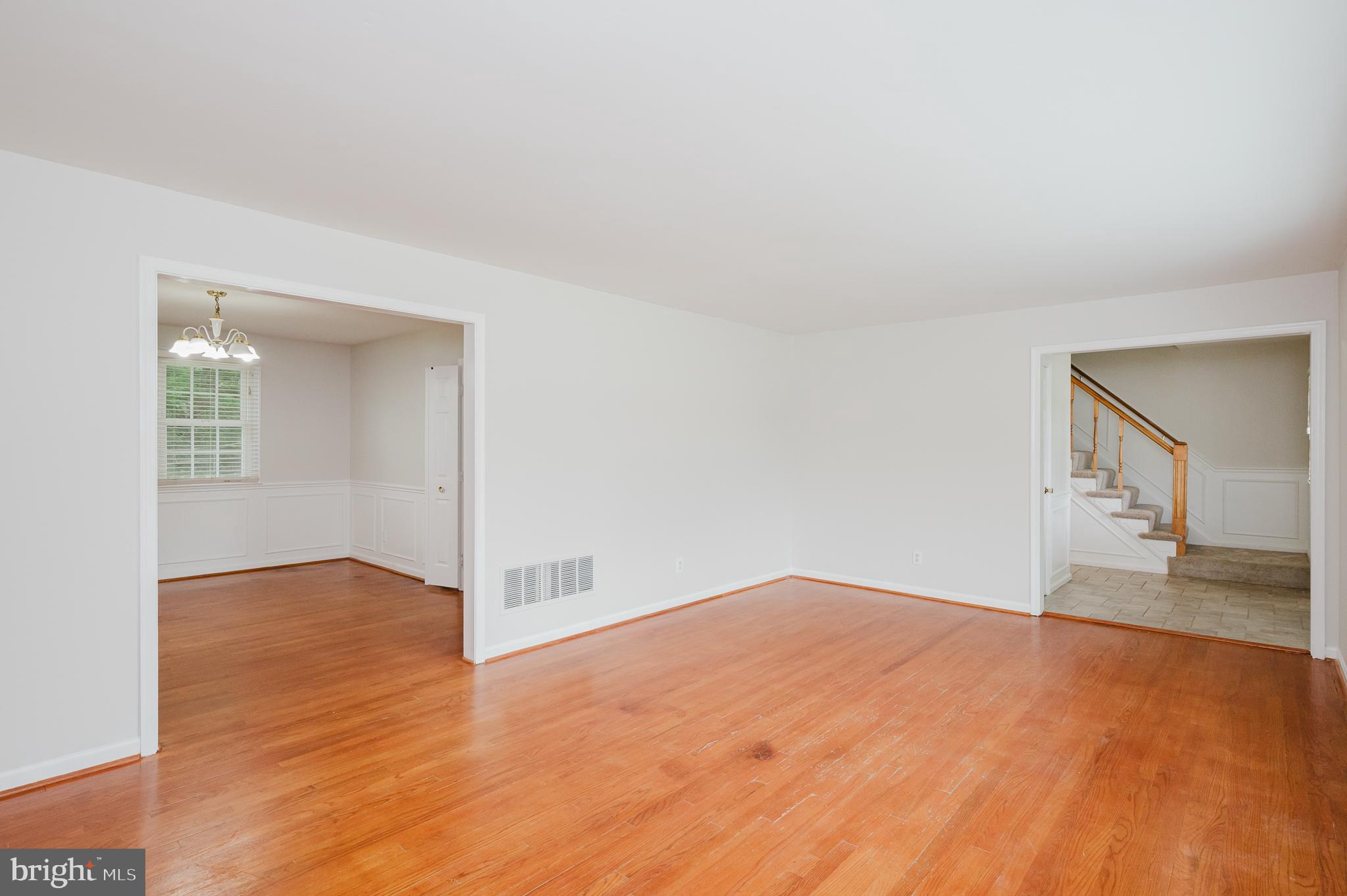 4 Old Spring Court Cockeysville, MD 21030 - Photo 4 of 53 a view of empty room with wooden floor and fan
