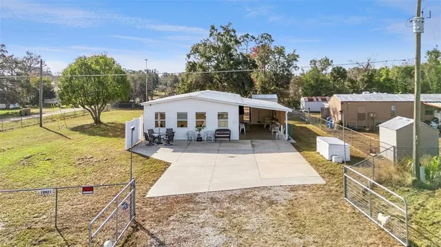 a view of a swimming pool with a patio
