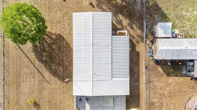 a view of a house with a tree