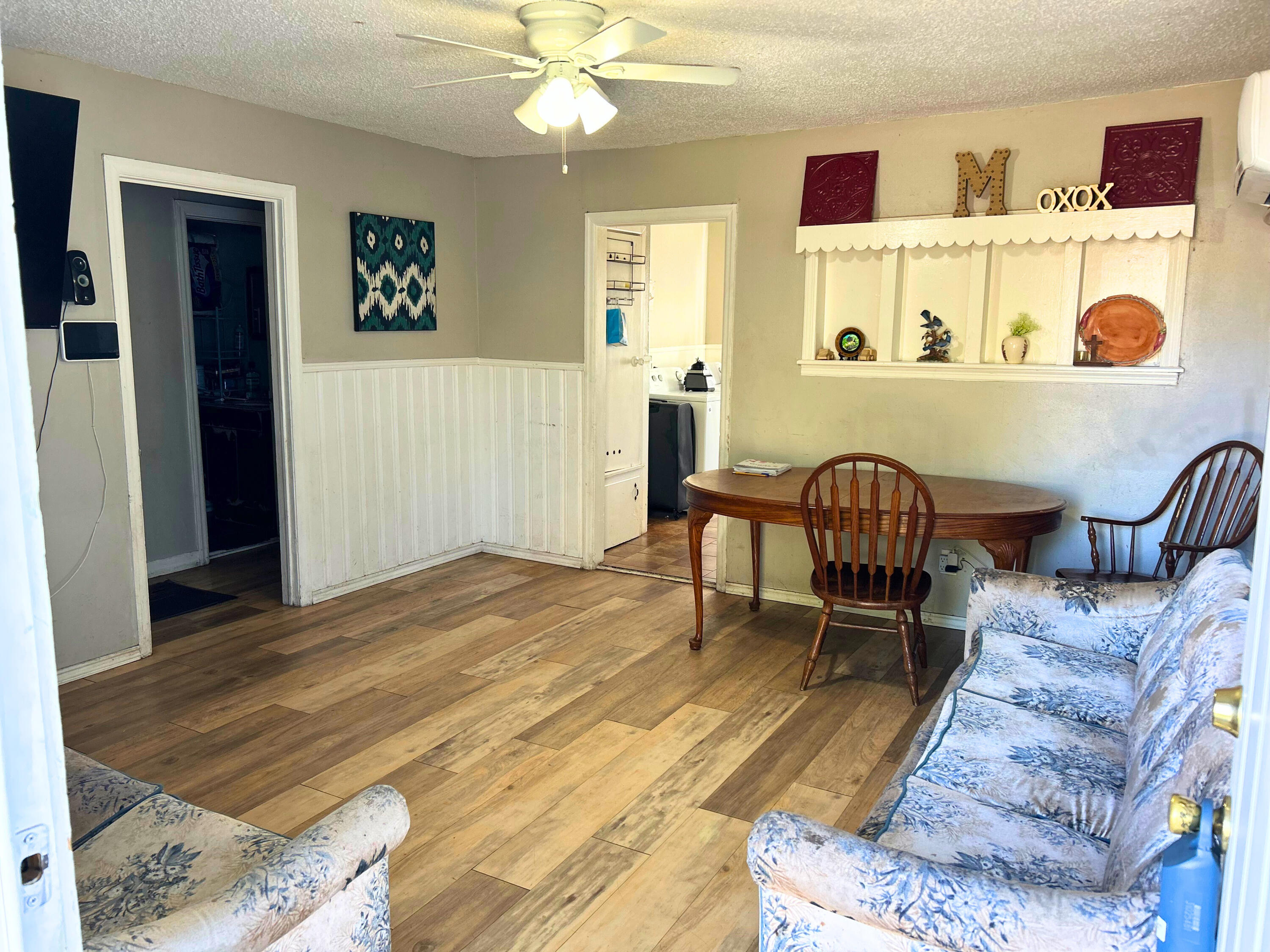 2205 39th Street Lubbock, TX 79412 - Photo 2 of 7 a living room with furniture and wooden floor