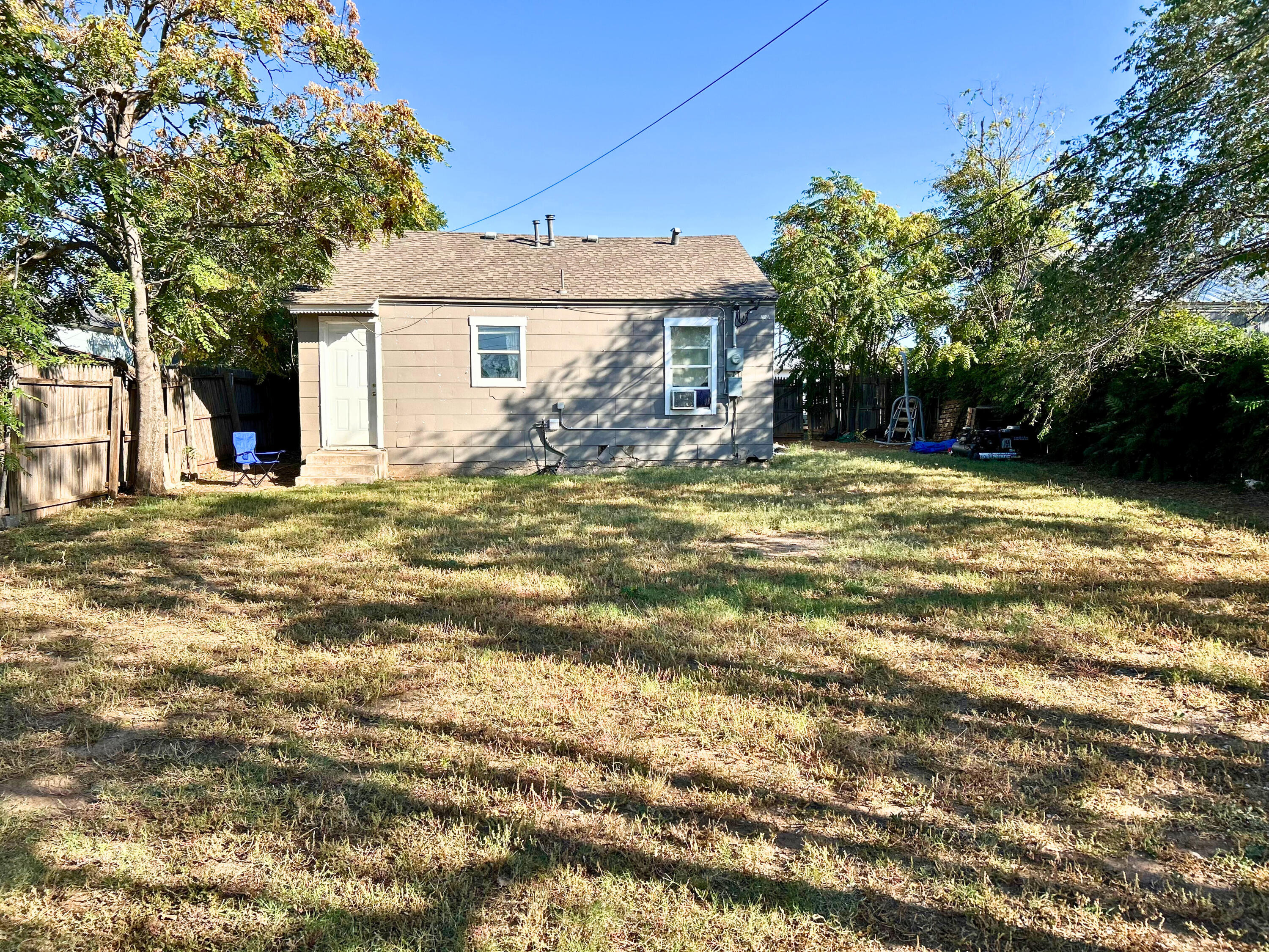 2205 39th Street Lubbock, TX 79412 - Photo 6 of 7 a view of a house with a swimming pool