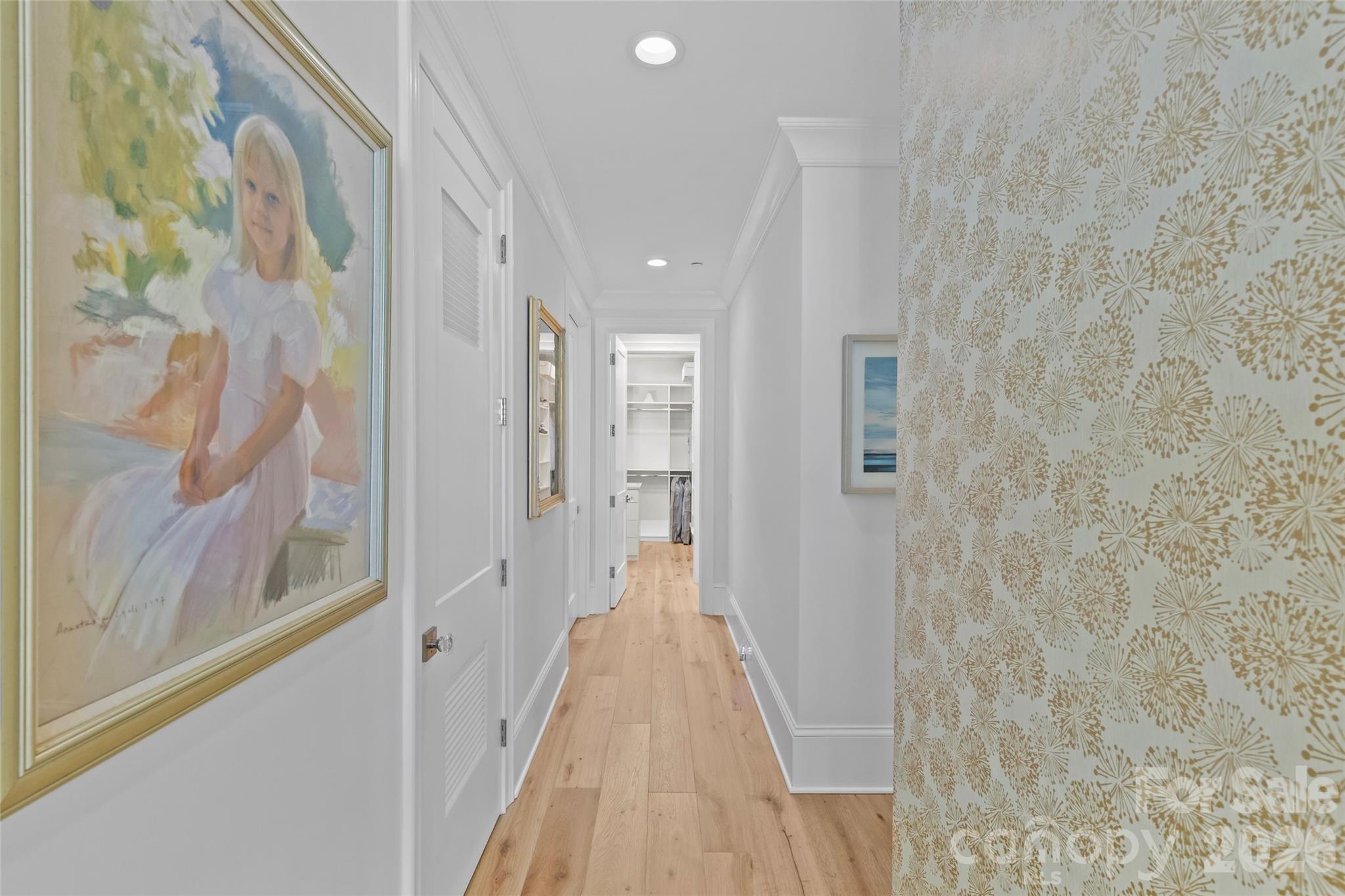 1500 Queens Road, Unit 104 Charlotte, NC 28207 - Photo 20 of 41 a view of a hallway with wooden floor and a bathroom