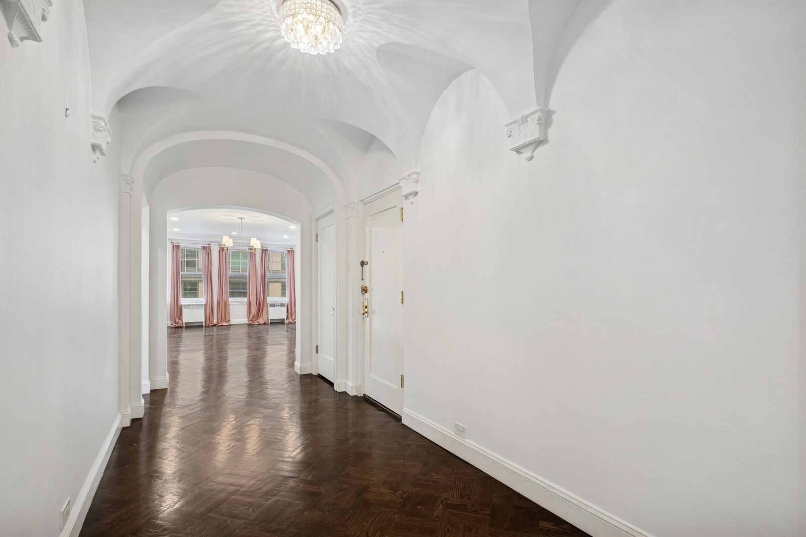 1640 East 50th Street, Unit 13B Chicago, IL 60615 - Photo 5 of 16 a view of a hallway with wooden floor