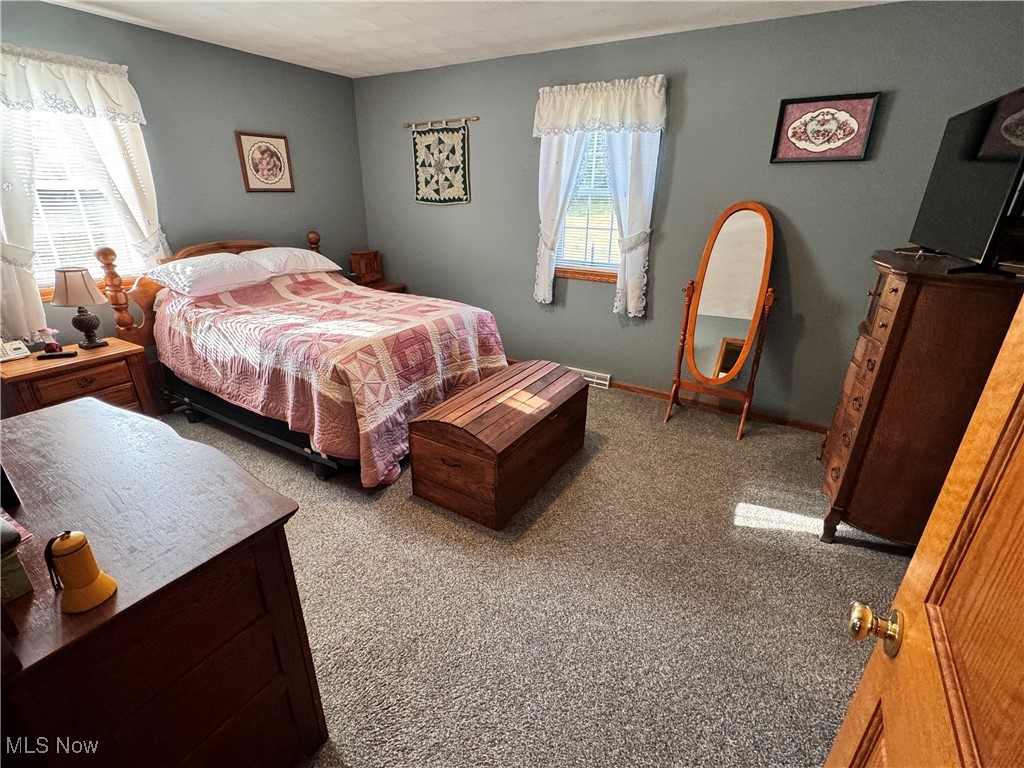 58410 Wharton Road Barnesville, OH 43713 - Photo 18 of 36 Carpeted bedroom featuring a textured ceiling