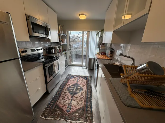 a kitchen with a stove and a microwave