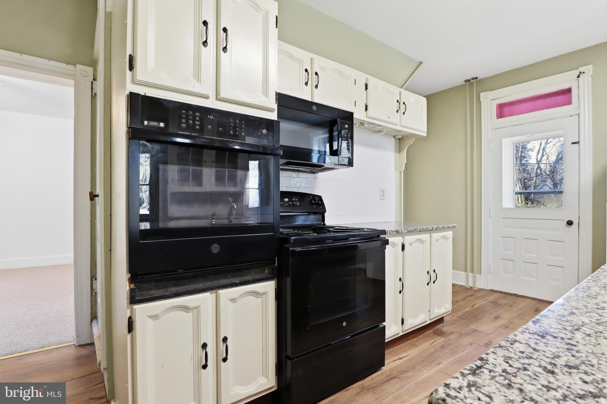 1545 Lititz Road Manheim, PA 17545 - Photo 11 of 66 a kitchen with stainless steel appliances granite countertop a stove and a refrigerator