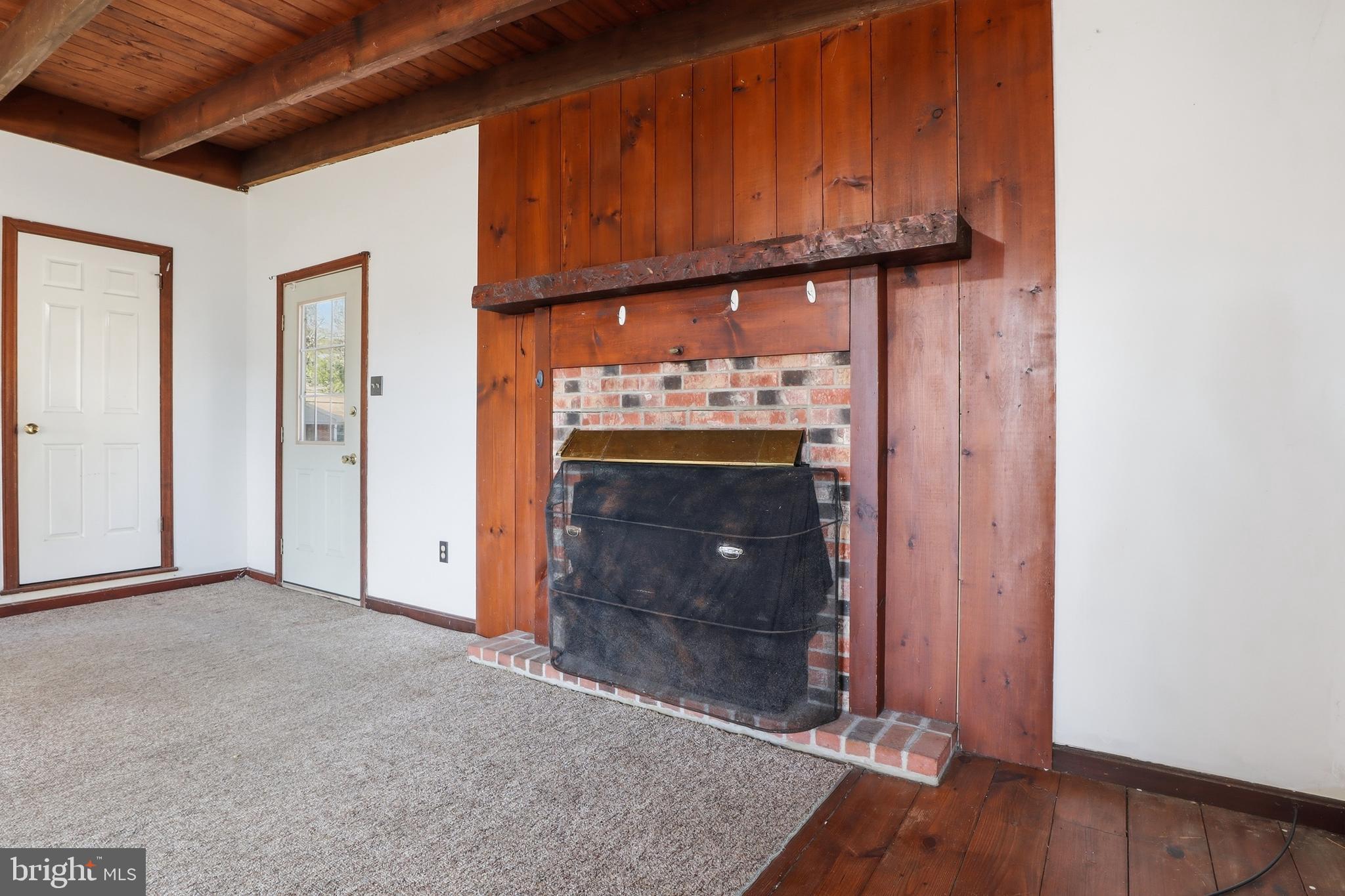 1545 Lititz Road Manheim, PA 17545 - Photo 19 of 66 a view of a livingroom with wooden floor and a fireplace