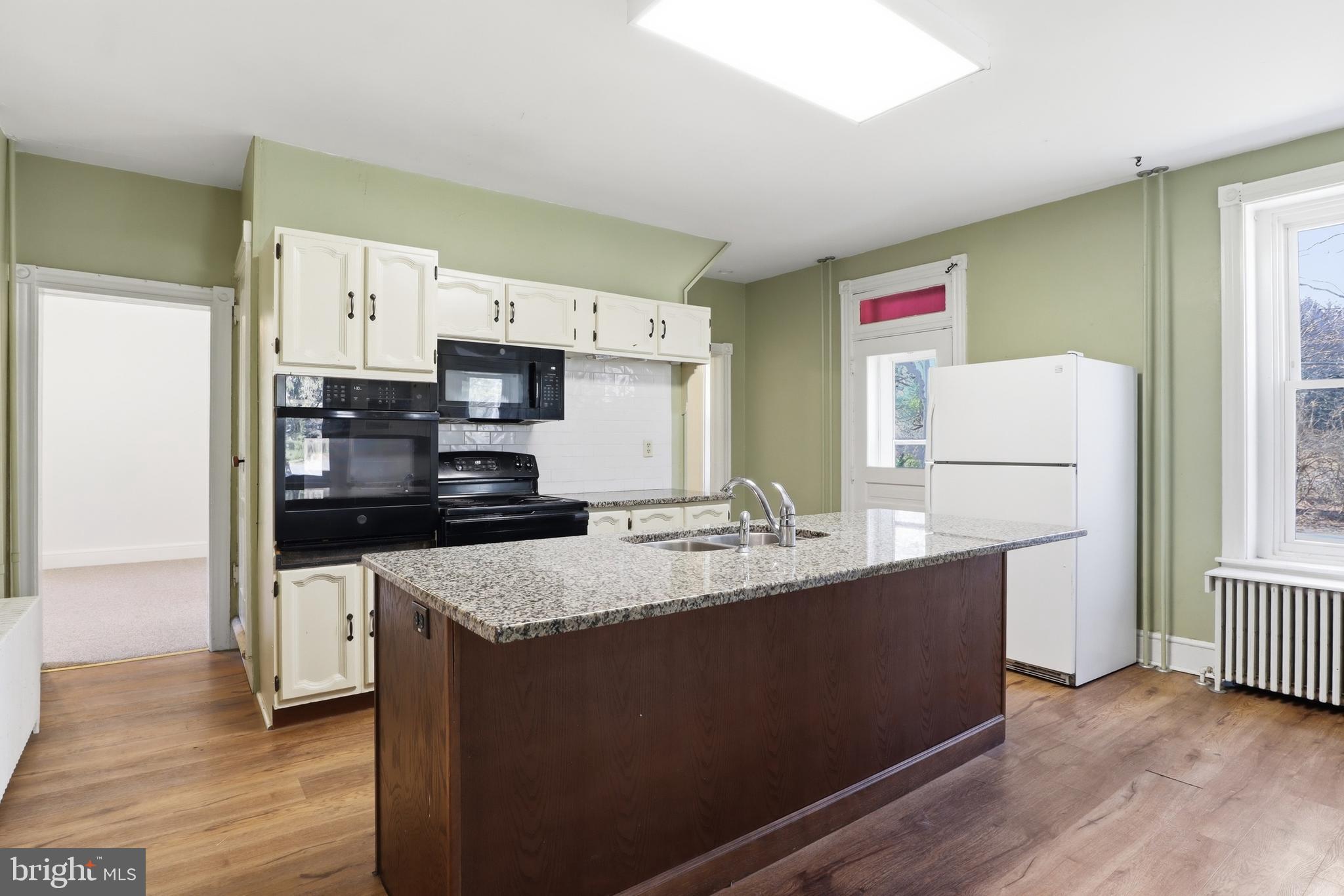 1545 Lititz Road Manheim, PA 17545 - Photo 7 of 66 a kitchen with stainless steel appliances granite countertop a sink stove and refrigerator