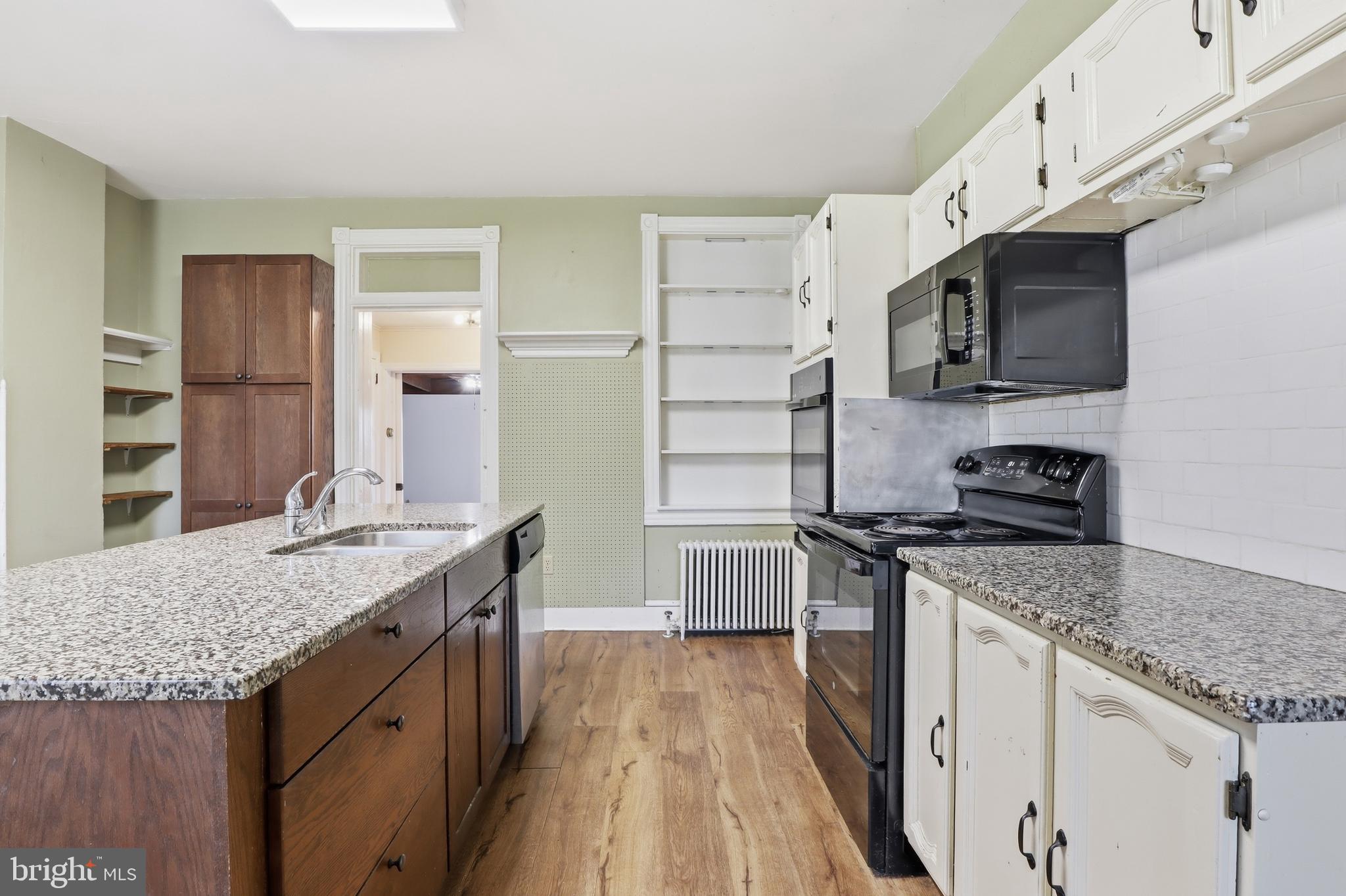 1545 Lititz Road Manheim, PA 17545 - Photo 9 of 66 a kitchen with stainless steel appliances granite countertop a sink stove and refrigerator